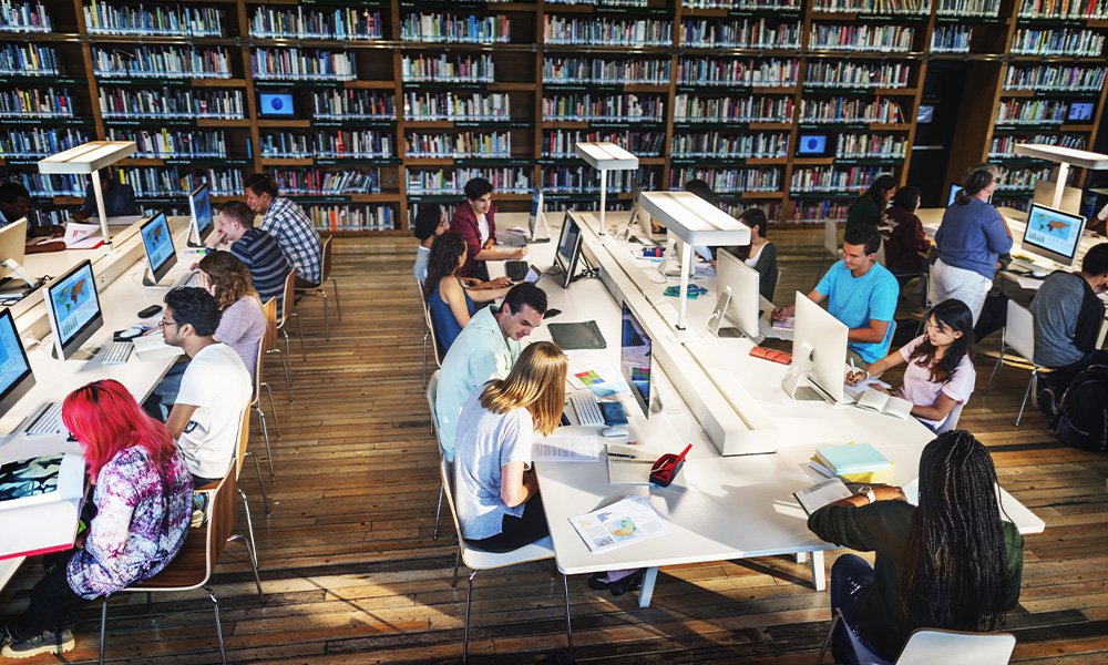 Students working at computers in a university library